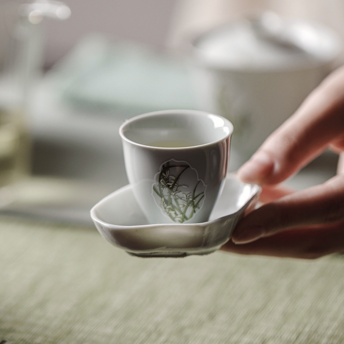 Gu Qing Porcelain Window Orchid Tea Cup